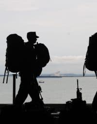 Silhouette of soldiers walking.
