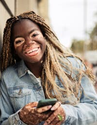 Smiling woman with vitiligo.